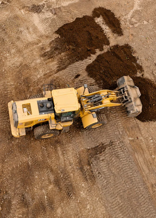 Excavator carrying out hillside repairs